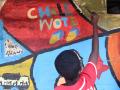 Kind malt bei streetartfestival